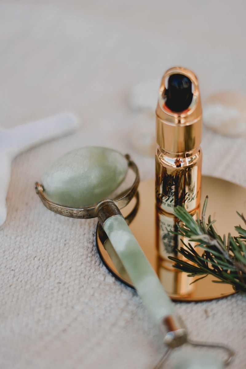 Photo by Content Pixie silver and black tube type vape beside silver spoon and silver spoon